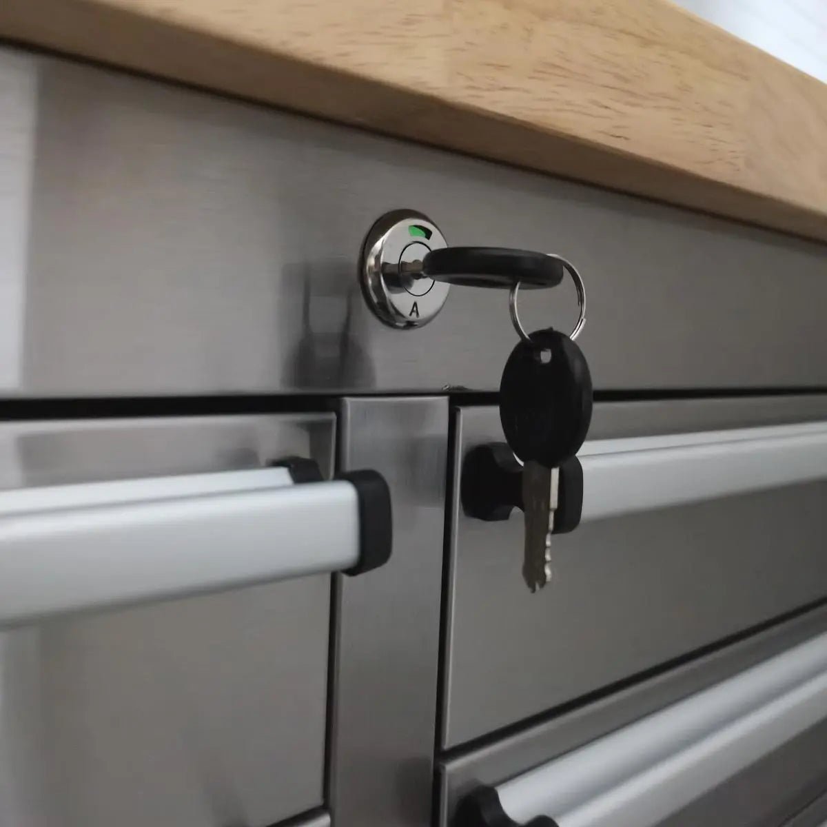 96″ Stainless Steel Rolling Workbench, Rubberwood Tabletop, 24 Lockable Drawers, Locking Wheels, TMG-WB9624S