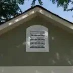 Installed Meridian 8 ft. x 10 ft. Wood Storage Shed with Autumn Brown Shingles