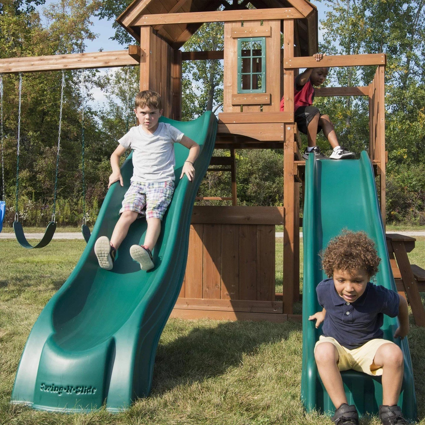 Swing-N-Slide WS 8353 Knightsbridge Deluxe Wooden Swing Set with Two Slides Climbing Wall Swings Glider & Picnic Table Wood